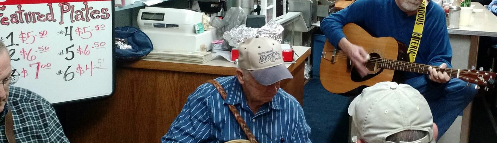 Men with banjos in store